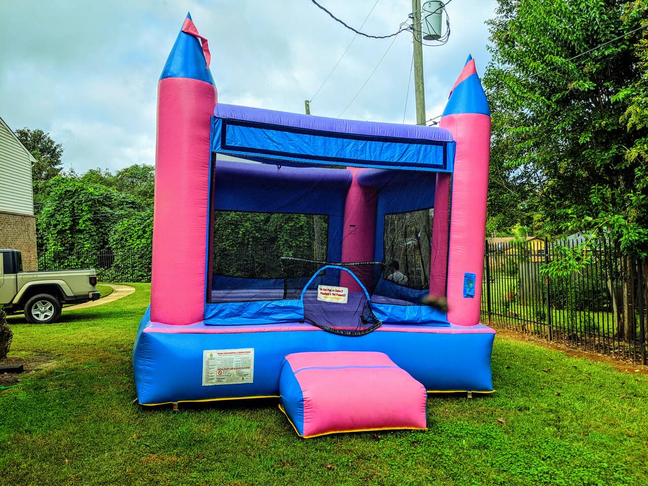 Pink and purple inflatable bounce house