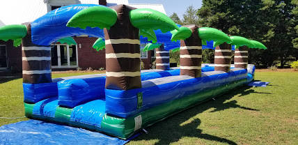 Actual Wow Inflatables Tropical Dual Slip N Slide rental unit